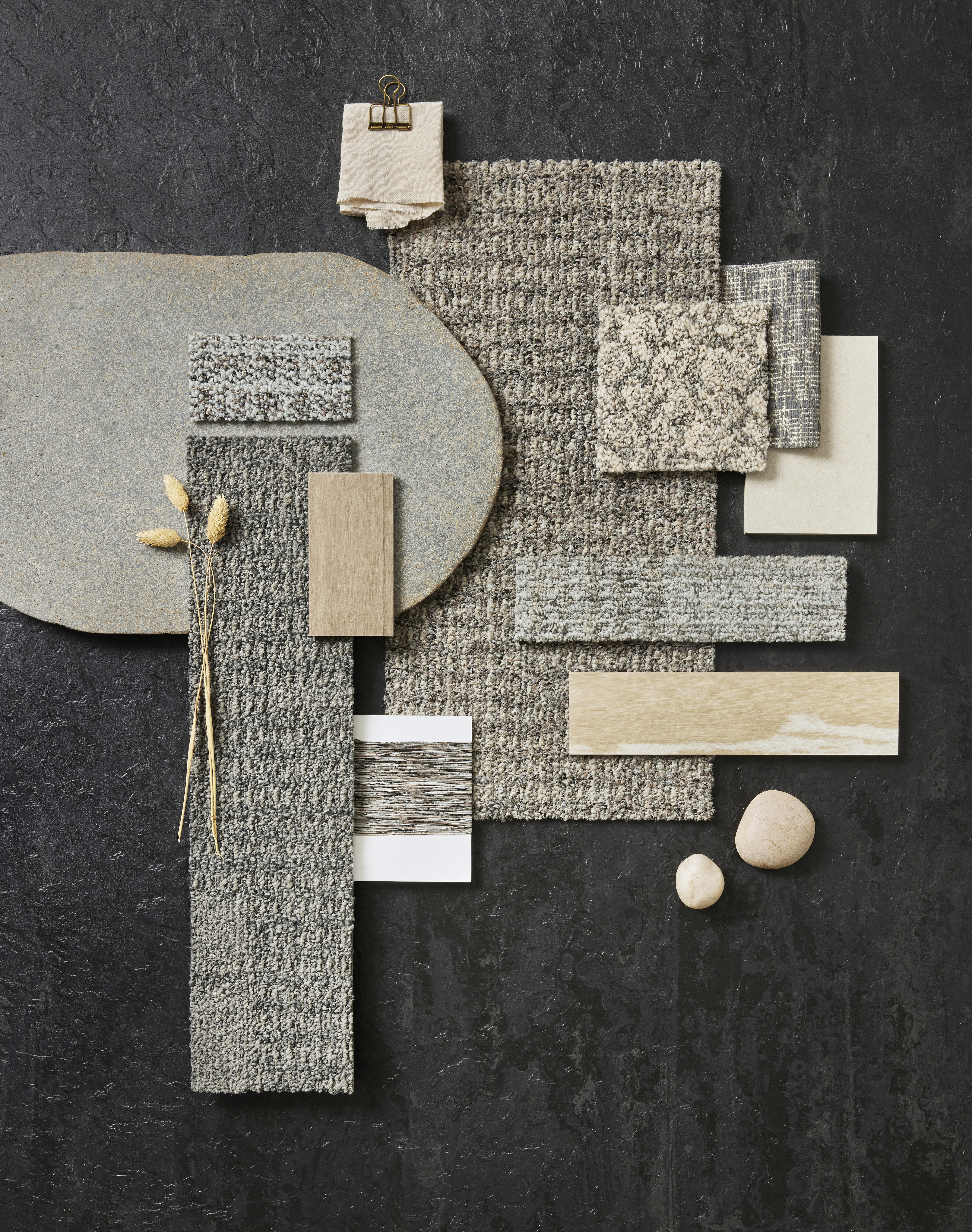 Tabletop palette of Interface Etched & Threaded carpet tiles with Earthen Forms LVT and norament arago rubber